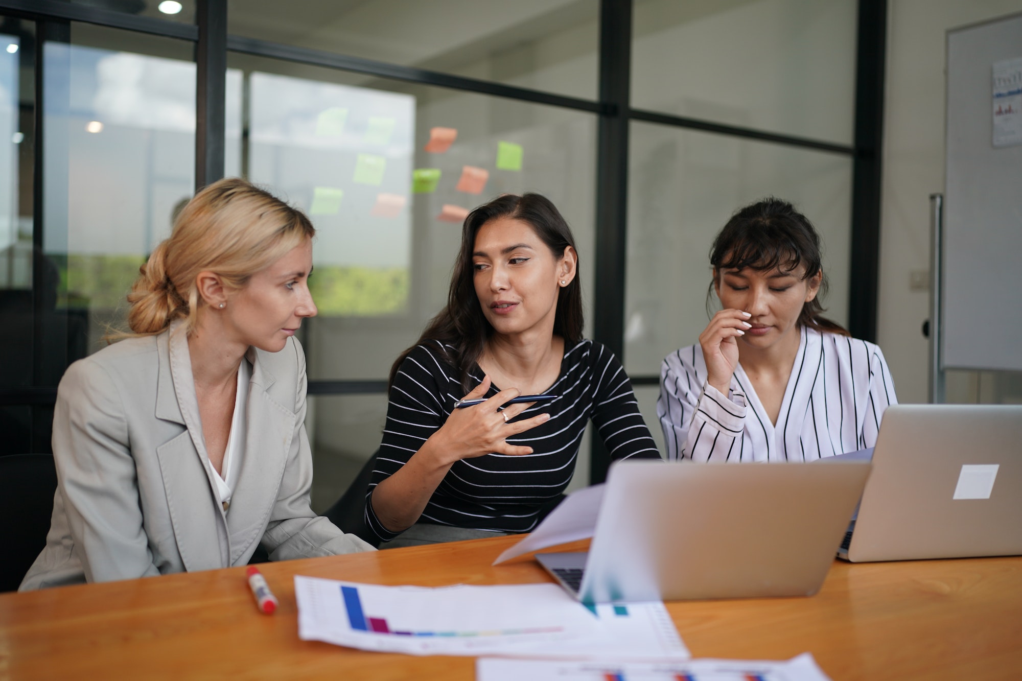 Coworkers Giving Speech Presenting New Idea To Colleagues In Office